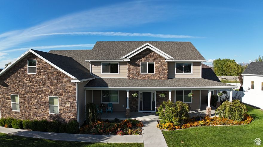 Move-in ready and priced below an October 2024 appraisal, this stunning custom-built five-bedroom home offers over 4,100 square feet of finished living space in a peaceful setting directly adjacent to Glen Eagle Golf Course. The main level features a spacious primary suite with new carpet, a walk-in closet, a deep jetted tub, and a separate shower. You'll also enjoy a beautifully remodeled kitchen with custom hickory cabinets, granite countertops, double ovens, a six-burner stove, and a large island-perfect for cooking, entertaining, and gathering. Multiple living spaces on the main level provide comfort and style for everyday living. Upstairs, you'll find a huge bonus room with a kitchenette, four additional bedrooms, and a large storage room. The upstairs bathroom includes dual sinks with a separate shower and toilet area, making it ideal for busy mornings. The oversized 1,320 sq. ft. three-car garage was designed to accommodate full-size trucks and SUVs, with deep stalls and 11-foot ceilings. The .41-acre lot provides plenty of space for entertaining, gardening, extra parking, or RV storage. Additional highlights include wiring for a backup generator, dual furnaces and air conditioners, and two 40-gallon water heaters. A spacious storage room above the garage could serve as a sixth bedroom, while the main-level hair salon-with its own exterior entrance-could be converted into a home office or seventh bedroom. Enjoy the inviting wraparound front porch and a covered back porch, surrounded by a mature, landscaped yard. Located across from Hole 5 and with views of Hole 6, this property combines the tranquility of golf course living with the convenience of nearby amenities. Ideally situated less than two miles from the new West Davis Highway, the home offers easy access to major routes: just 30 miles from downtown Salt Lake City, 9 miles from Hill Air Force Base, and 30 miles from Snowbasin Ski Resort. Experience the best of both worlds-peaceful living in a spacious, custom home with quick access to everything Northern Utah has to offer.