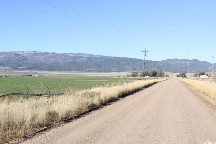 Flat parcel perfect for residential development. Beautiful views in growing area. Underground water rights in Area 73-South available for separate purchase. Includes two cell tower leases with approx. 16 years remaining, valued at $301,104. Homes and surrounding acreage (approx. 6 ac.) are excluded from parcel.