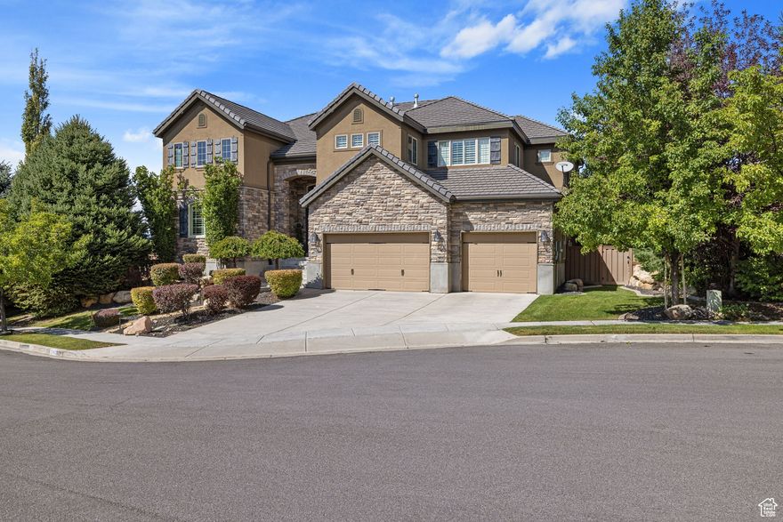 Welcome to your dream home in one of Lehi's most sought-after neighborhoods, "Woodhaven", nestled in the prestigious Traverse Mountain community area near Silicon Slopes. This beautiful 2-story home is 1 of 4 homes situated within a quiet Cul-de-sac offering mountain bench & valley views.  Once inside, beautiful, custom stained Walnut hardwood flooring throughout greets your feet. The double-height entrance foyer leads you into an open space living area adjacent to a well-appointed kitchen, complete w/ full Viking s.s. appliances, double wall ovens a large granite top island w/ weathered iron metal detailing, housing a gas countertop range, breakfast counter & custom wood, iron & frosted glass barn door concealing the pantry. The Walnut hardwood flooring continues down into the  basement which is an entertainer's delight featuring a full 2nd kitchen equally adorned w/ Viking s.s. appliances, guest room, full bathroom, home gym adjacent to a glass enclosed steam shower & a tiered floor theater room for movie nights w/ friends or family.  French door basement entrance leads you to a natural stone patio, a private hot tub, a matured landscaped, private backyard & a trellis covered deck w/ a luxury, s.s. & granite topped, luxury outdoor bbq/grill bar, ideal for outdoor activities & gatherings.  Retreat upstairs to a gorgeous primary bedroom suite w/ dual sided fireplace, a spacious "his & hers" walk-in closet, primary bath w/ dual-sink vanity, large soaking tub, luxe glass-enclosed shower & private water closet. A three-car garage provides ample storage for vehicles & outdoor gear.  Don't miss the opportunity to make this exceptional property your own!  Sq. ft. figures are provided as a courtesy estimate only. Buyer is responsible to verify all listing information & is advised to obtain an independent measurement.