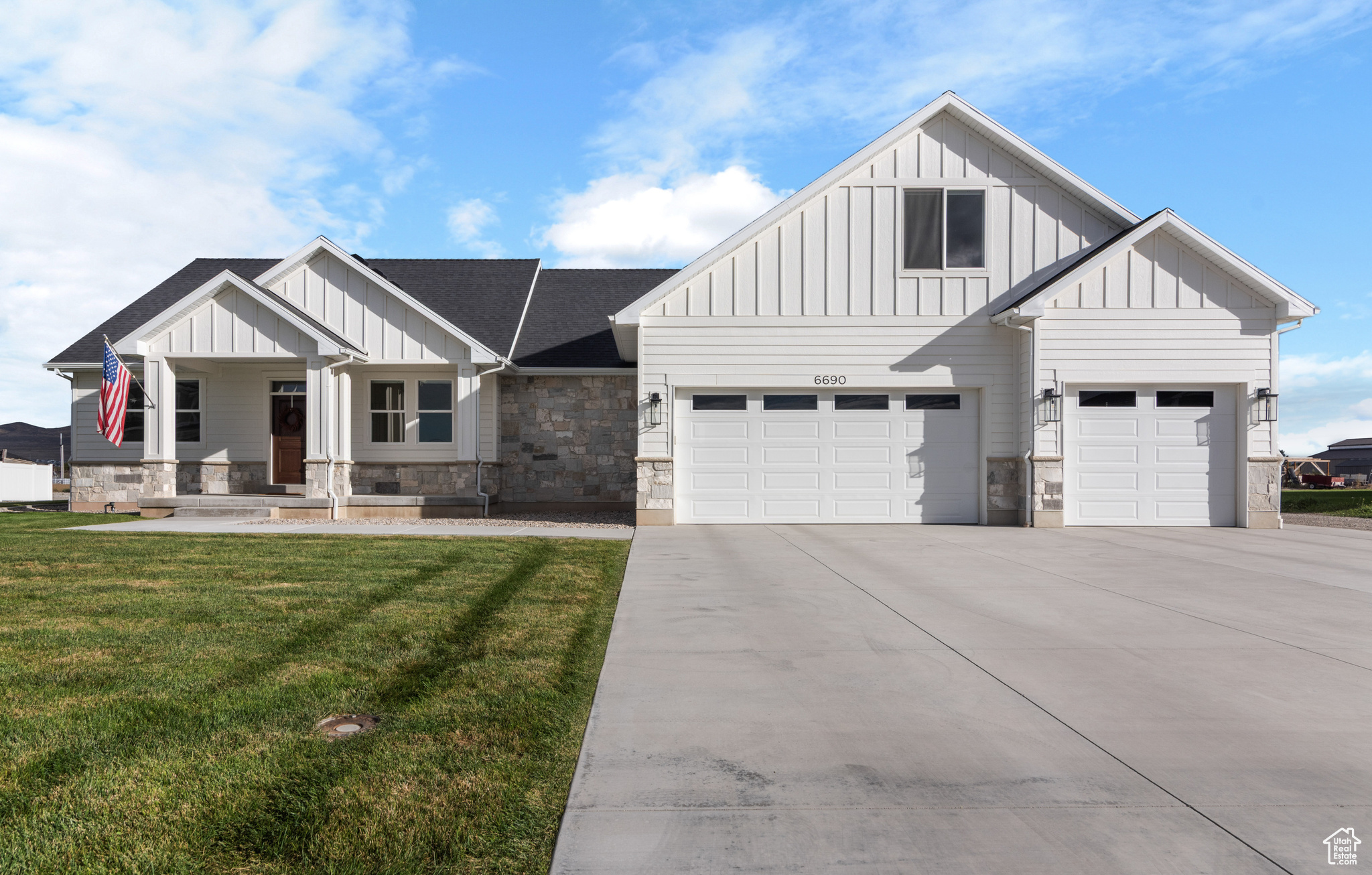 Beautifully designed custom home on 1.59 acres. This thoughtfully crafted home features 4 bedrooms, 2.5 bathrooms, a designated office, a spacious bonus room with its own HVAC system, a large storage room, and an oversized 4-car garage complete with a utility sink. High-end upgrades are found throughout, including custom white oak cabinetry, quartz countertops, steam oven, and luxury vinyl plank flooring. The master bathroom offers a luxurious retreat, while the natural stone fireplace creates a stunning centerpiece in the living area. The exterior showcases natural stone and Hardie siding for a timeless look. Enjoy outdoor living on the covered back patio with a built-in gas fire pit, or take advantage of the large yard with space for entertaining and potential horse property. A south-facing driveway ensures convenient winter maintenance. Schedule your showing today and experience all this home has to offer. Square footage and acreage figures are provided as a courtesy estimate only. Buyer is advised to obtain independent measurement.