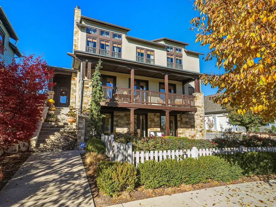 Experience luxury lakeside living in this premier Daybreak waterfront home, where elegance meets comfort. Enjoy unobstructed lake and mountain views from multiple decks and every bedroom in the home, all just steps from trails, parks, and the beach. Inside, natural light floods through walls of windows, highlighting custom finishes and a bright, open layout. The great room with gas fireplace and elegant built-ins opens to an inviting patio, perfect for entertaining. The primary suite is a serene retreat with vaulted ceilings, breathtaking views, and a spa-inspired bath. The lower-level walkout offers ideal space for a gym or recreation area with a brand new furnace & A/C. Surrounded by manicured landscaping and exceptional privacy, this home blends refined design with everyday livability in one of Daybreak's most coveted locations.