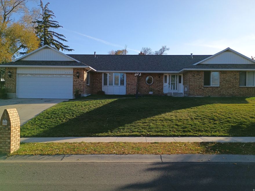 Welcome to this spacious custom built 7 bedroom, 3 and a half bathroom home located in a great centrally located neighborhood. This stunning property boasts a generous living space of over 5,200 square feet, perfect for large families, multi-family or home based business. The home has a new 50 year roof, 2 kitchens, 2 laundries and 4 fireplaces (3 wood, 1 gas insert), a walk out basement, covered patio, main bedroom deck and a heated main garage. Outside, the large private backyard offers a long RV driveway, 2 car shop with 2 heated offices and a cold cellar with newer metal roof and a 2 RV carport. The property has full sprinklers, 7 mature fruit trees, Blackberries & Grapes as well as a vegetable garden area.