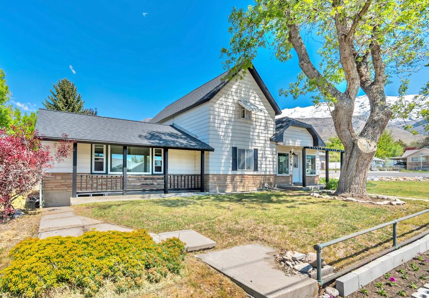 MULTIPLE OFFERS RECEIVED. Offers Due Sunday May 10th by noon. Charming remodeled farmhouse in the heart of Pleasant Grove! This beautifully updated historic home blends timeless character with modern upgrades.  Every room has been thoughtfully refreshed. The bright, open interior features abundant natural light throughout, an updated kitchen with a spacious quartz island, and stylishly renovated bathrooms, including a luxurious freestanding tub. A large laundry and mudroom adds every day convenience and functionality. The walk-out basement provides added versatility, while the expansive .30-acre lot offers a stunning backyard with new sod and breathtaking mountain views. A rare opportunity to own a piece of history with all the comforts of today.  Square footage figures are provided as a courtesy estimate only and were obtained from Appraisal.  Buyer is advised to obtain an independent measurement.
