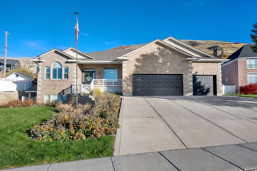 **OPEN HOUSE SAT. 5/2 11 AM - 1 PM** PERRY EAST BENCH! UNOBSTRUCTED VIEWS ! This stunning , All brick, west facing home, offers a perfect blend of luxury and family living. The large over 1/2 acre view lot, features no backyard neighbors and unobstructed mountain and valley views that create a tranquil atmosphere. Inside you will find spacious open concept living, with 10 ft. ceilings on both main and basement levels. The home is one level living at it's best! Highlighted by a large family great room, sunroom and 1/2 bath that seamlessly connects to an oversized, Chef's Gourmet Kitchen, equipped with new stainless steel appliances, including double ovens, and an abundance of upgraded staggered cabinetry, large pantry and farm sink. The home has been meticulously remodeled with 3 inch quartz countertops, new carpet, fresh paint, LED lighting and LVP flooring in the bathrooms, laundry room and sun room. Includes 3 bedrooms up, 2, and 1/2 baths, formal living room/office, and separate craft room/exercise room. Step outside to your backyard oasis, complete with a large covered deck, featuring TREX decking, 2 ceiling fans and a natural gas BBQ, making it perfect for entertaining. The beautifully landscaped park like yard incudes full yard LED flood lighting, in ground fire pit, a basketball court, 4 square, a sand play area with swing set, and putting green, all surrounded by mature trees and shrubs and fully fenced. For added convenience, the home is equipped with an in home elevator and a separate chairlift in the spacious 3 car garage, ensuring ease of access throughout. Home is wired for a whole home generator. The oversized primary suite, boasts an extra large ensuite bath, and walk in closet, that connects to the laundry room, along with double vanities and an extra large tub and separate shower for your comfort. The basement features a private, covered walkout, daylight entrance, for the potential mother in law apartment, in floor heating, 3 bed, 2 bath, 2nd laundry, home theater room, indoor exercise lap pool and tons of storage. The roof was replaced in 2017. 100 % WHEELCHAIR ACESSABLE. Located on a quiet street surrounded by spacious estate homes, this property is not just a house, its a home where memories are made! All just a short drive from city parks, schools, shopping, restaurants, entertainment, skiing, boating and freeway access! Come experience the perfect blend of luxury and comfort - your Family's Gathering Paradise awaits!!! Owner agent.