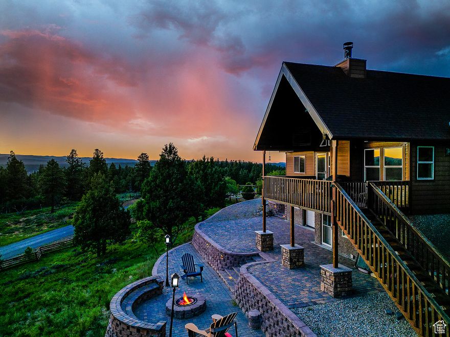 Up to one horse per acre allowed! Welcome to your Duck Creek Cabin Hideaway on 2.42 private wooded acres in the coveted Elk Ridge Estates community. It's ideal for year-round living, a weekend getaway, or a short-term rental. The main living area features stunning A-frame windows with views of the surrounding forest. Outside, enjoy tiered outdoor living, including an upper deck & two terraced patios carved into the hillside. One level features a fire pit. With Bryce Canyon, Zion National Park, and Brian Head Ski Resort nearby, your basecamp for year-round adventure is ready. A gated driveway and paved roads offer easy access year-round. The option to purchase fully furnished makes this cabin move-in or rental-ready.