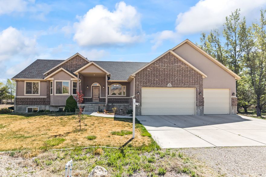 This charming Ferron home offers a rare blend of space, comfort, and character on nearly 2 acres in the heart of Emery County. The property provides plenty of room for outdoor activities, entertaining, animals, gardening, or simply enjoying extra privacy and elbow room. There may also be potential to subdivide, giving future owners added flexibility. Inside, the home has been well cared for and features an expansive open layout with generous living space, lots of storage, double-pane windows, and a 100% finished basement with a separate full entrance from the garage. The large lot includes RV parking, a large covered patio, a fire pit and plenty of space. Water shares may be included with the right offer. Whether you are looking for a peaceful retreat, a functional homestead, or a spacious property with room to grow, this is a rare find in Ferron. Square footage figures are provided as a courtesy estimate only and were obtained from county records. Buyer is advised to obtain an independent measurement.