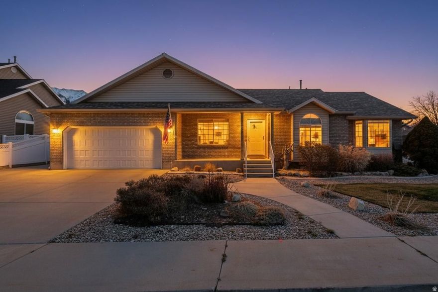 RENTAL INCOME POTENTIAL Rare Orem corner cul-de-sac property with mountain views and a combination nearly impossible to find in Utah County: two full primary suites with private en suites, a heated & cooled workshop with 220V power and a bathroom, dual RV/boat parking (50+ ft each), and a walk-out basement with private entrance and kitchenette - ideal for multi-generational living or a potential rental unit (buyer to verify ADU regulations). The workshop alone sets this property apart - fully conditioned, 220V wired, and bathroom-equipped, making it a true asset for contractors, hobbyists, or home-based businesses. Two oversized RV/boat parking stalls mean no storage fees. Major updates done: new furnace & AC (2023), water heater (2021), LVP flooring, new carpet, quartz countertops, radon mitigation system, and hot tub pre-wire on lower patio. Xeriscaped yard, covered patio, and mature landscaping. One mile to I-15, minutes to UVU, BYU, schools, and shopping. Buyer to verify all information, measurements, and rental/ADU regulations.