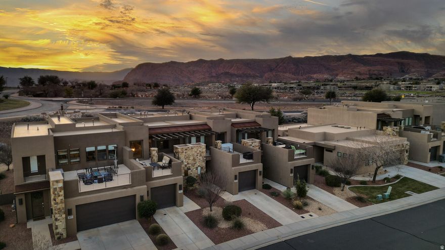 Welcome to The Escapes at the Ledges in Southern Utah! This exquisite home offers a perfect blend of comfort and elegance, and is not only a fantastic getaway but also a great investment opportunity. Inside, you'll find three spacious bedrooms, including a fun and cozy bunk room that's perfect for kids or guests.  The open-concept living area features a beautiful white kitchen, ideal for entertaining, and flows seamlessly into a stylish dining and living space. Step outside to the rooftop patio, where you can unwind and take in the stunning desert landscape. Or head to pickleball courts for a game and then take a dip in the community pool or hot tub! Whether you're looking for a peaceful retreat or a vibrant vacation spot, this property offers it all.