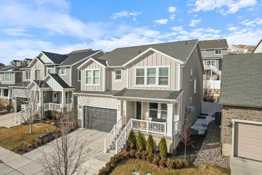 Located on the east side of Lehi, this home in Canyon Hills puts you right where buyers want to be-close to the freeway, Thanksgiving Point, and all the restaurants and shops at the point of the mountain.  Spend your summers on the Murdock Trail, sitting by the community pool, hot tubbing, at the pickleball courts, and spend winter days on one of the best sledding hills around. The fully fenced backyard stays shaded and comfortable in the summer, with quick snow melt on the driveway in the winter.  Enjoy the perks of a new build home (new roof, plumbing, furnace, etc.), but with custom finishes and designs that feel far from "cookie cutter".