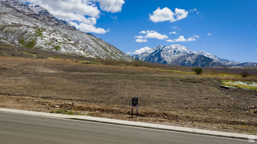 1-acre lots with views like this are rare. Build on Santaquin's beautiful East Bench and enjoy mountain and valley views. Bring your own plans or let us help design a custom home that fits your vision. Subject to building with Bastian Homes, LLC. Buyer to verify all information