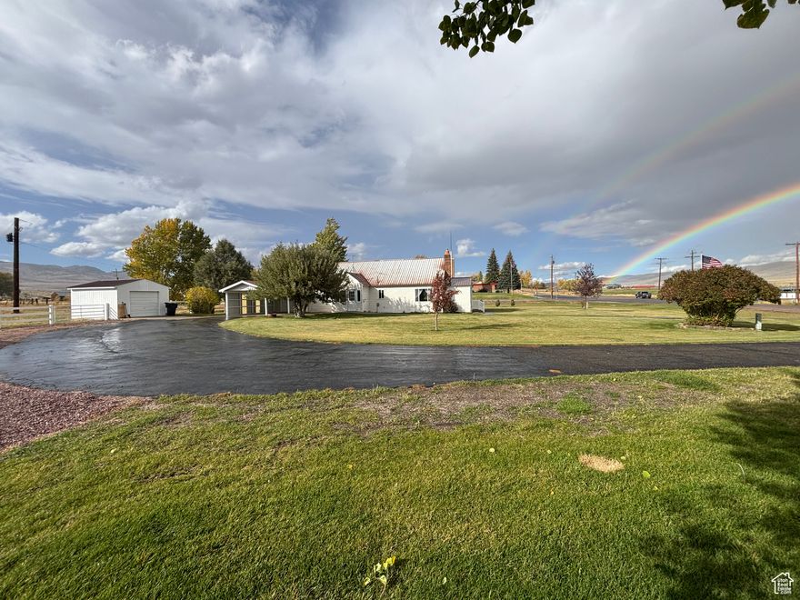 Charming country home with acreage for an affordable price! Only 15 minutes from Bear Lake's beautiful North Beach Rd!! Why spend tens of thousands more on the nearest-priced comparable, when you could snag this 5 bedroom farmhouse on ~2.4 acres for $399k?? Especially when it's been as updated and well-cared for as it has! Also the main floor and master bed/bath suite are handicap accessible and friendly in every way. Includes one share of secondary water. Perfect horse property or to have a hobby farm! Acreage is an estimate and will be verified with survey scheduled within next 6 weeks or so, and ~2.4 acres includes ~1.1 acres where home sits and ~1.3 acres kitty corner NE from home across highway, which has its own tax ID number for potential separate residence! Delicious culinary water comes from nearby spring, much tastier than nearby wells! Plenty of covered and uncovered patio space lends itself to relaxing mornings and evenings. Stay connected with fiber optic internet, and enjoy the immaculately landscaped yard with a variety of mature trees, including an apple tree. The park and pavilion next door ensure you won't have western next door neighbors anytime soon. Come make this serene home and property your own! Square footage figures are provided as a courtesy estimate only. Buyer is advised to obtain an independent measurement.