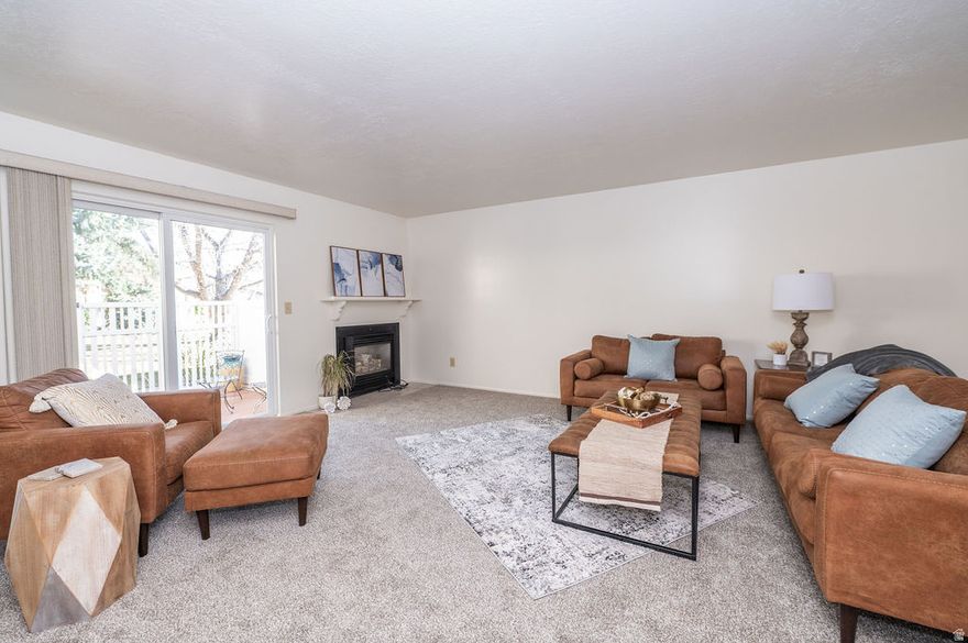 Beautifully updated ground level end unit condo in a prime Riverdale location. This 2 bedroom, 2 bath home features all interior living space on one level with an open concept layout. Entry from the attached 2 car garage and access to 2 private patios require only minimal steps. Recent updates include new paint, tile, carpet, and LVP flooring, creating a clean, move in ready feel. The primary suite offers a private bathroom and generous closet space, with a walk out patio and a majestic view of the mountains. The second bedroom providing added flexibility for a bedroom or an office. Additional highlights include in unit laundry, 2 private patios, and an end unit location offering extra privacy and natural light. Conveniently located directly across from the community swimming pool, this low maintenance home offers comfort, functionality. HOA covers water, sewer, trash, and snow removal.