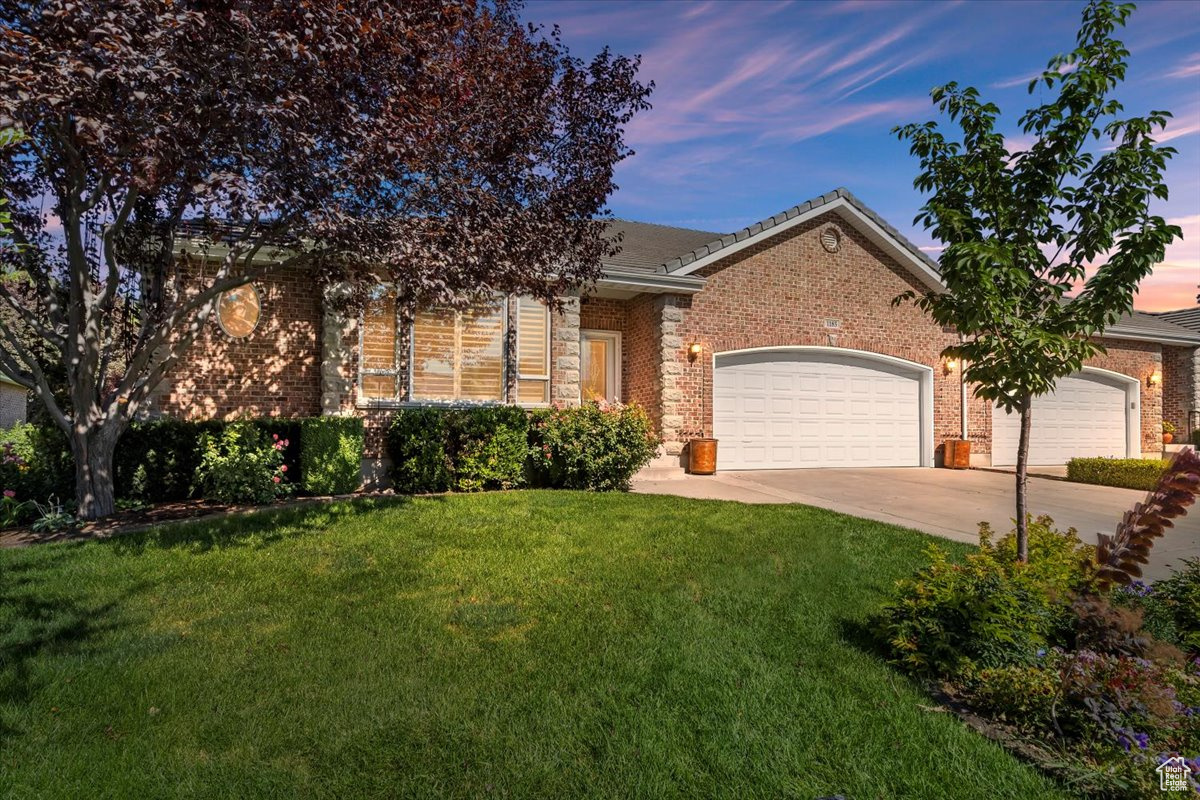 Located in an upscale 55+ community beside Fox Hollow Golf Course, this beautifully maintained brick rambler offers over 4,500 square feet of refined living space and a layout that blends comfort, elegance, and a little "wow" around every corner. Enter through a gracious hallway that sets the tone for the home's spacious design. Just off the entry, a custom-built office/den with full wall cabinetry makes the perfect work space or cozy library retreat. The main living area offers a welcoming atmosphere and a fireplace-perfect for quiet evenings or impressing company. The kitchen is a chef's dream without being fussy: granite countertops, an island with breakfast bar, vaulted ceiling, microwave, dishwasher, disposal, pantry, and a brand new double oven with built-in air fryer. Glass-front cabinets let you show off the "good stuff," and there's plenty of room to prep, cook, and hold court. The oversized primary suite features tray ceilings, a sitting room that opens onto a covered Trex deck with outdoor lighting, and its own cozy fireplace for ambiance. The ensuite bath offers double sinks, custom cabinetry, a jetted tub, separate shower, and grab bars for added peace of mind. The walk-in closet? Let's just say if Narnia is hiding anywhere in the house, it's probably in there. Upstairs also includes a spacious laundry room with a sink, folding counter, and hanging bar, plus a generous half bath for guests. Downstairs, the daylight basement is fully finished with a third living room featuring its own fireplace, large enough for a pool table, foosball, or just epic movie nights. There's a wet bar with a mini fridge and microwave, a charming painted under-stair nook, three additional bedrooms, and a full bath with double sinks. And the storage-well, if you need a place to stash your holiday decor, vintage ski gear, and 16 slow cookers, you're in luck. Additional features include a two-car garage, radon mitigation system, water softener, and charming flower boxes. Thoughtfully designed and impeccably maintained, this home delivers elevated living in one of the area's most sought-after 55+ communities. Bonus: You're just a 5-minute drive to Walmart and Walgreens, and 8 minutes to Target, restaurants, and shopping. Come see for yourself-the details speak volumes.