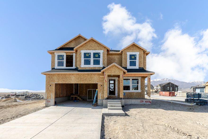 Welcome to Rose Ranch-an exciting new community in the heart of Eagle Mountain! These thoughtfully designed single-family homes shine with larger lots, giving you space for a three-car garage and plenty of outdoor living. Rose Ranch offers a vibrant, community-focused lifestyle with pickleball courts, the Eagle Mountain Ranch Bike Park, nearby schools, and easy access to local favorites like The Ranches Golf Club, Utah Lake, scenic parks, and trails. Surrounded by stunning mountain views, it's the perfect place to call home. Contact us today to start planning your future in Rose Ranch! (MORGAN LOT 126)