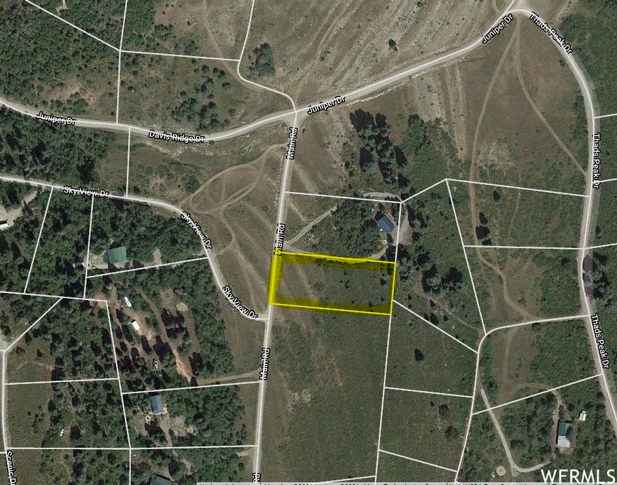 Nice, flat 3/4 acre view lot in the Skyline Mtn gated Resort next to open area! Located high on the hill, this property has a beautiful 360 degree view. This would be an easy lot to start using with hardly any work. HOA fees are only $60 a month, which gives you access to tennis courts, pavilions for gatherings, a pickle ball court, a swimming pool and a golf course! Each lot owner receives a $60 punch-pass per year for golfing and swimming plus member pricing. This area has so many options for outdoor activities including hiking, camping, and four wheeling. During the winter months, snowmobiles are needed for access. Utilities: Sewer not available- septic tank would need to be installed. Water is hauled in from a central filling station about 1 mile away. Power is available with a connection fees of $4,500. Seller also owns J-6 just South of the common area and will sell it for the same price.