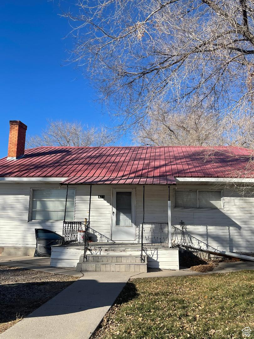 Great fixer upper.  Already has new metal roof.  New floors. Fireplace. Possible 3rd bedroom in basement.