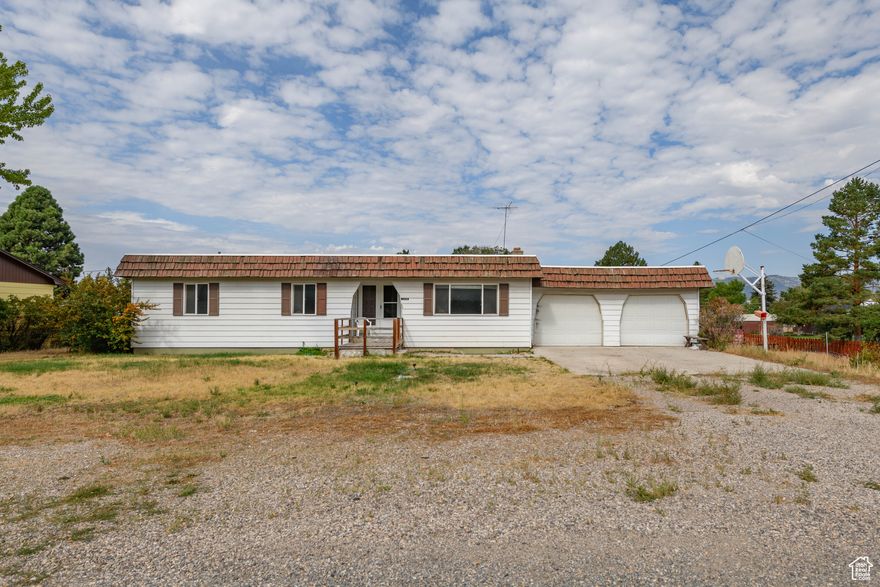 Calling all do-it-yourselfers-this classic handyman special is ready for fresh ideas and sweat equity. With 5 bedrooms and plenty of square footage, there's room to stretch out, and the unfinished basement is waiting for your personal touch. A wood-burning stove brings cozy character, while the covered back deck and patio look out over a huge yard that's wide open for your vision.