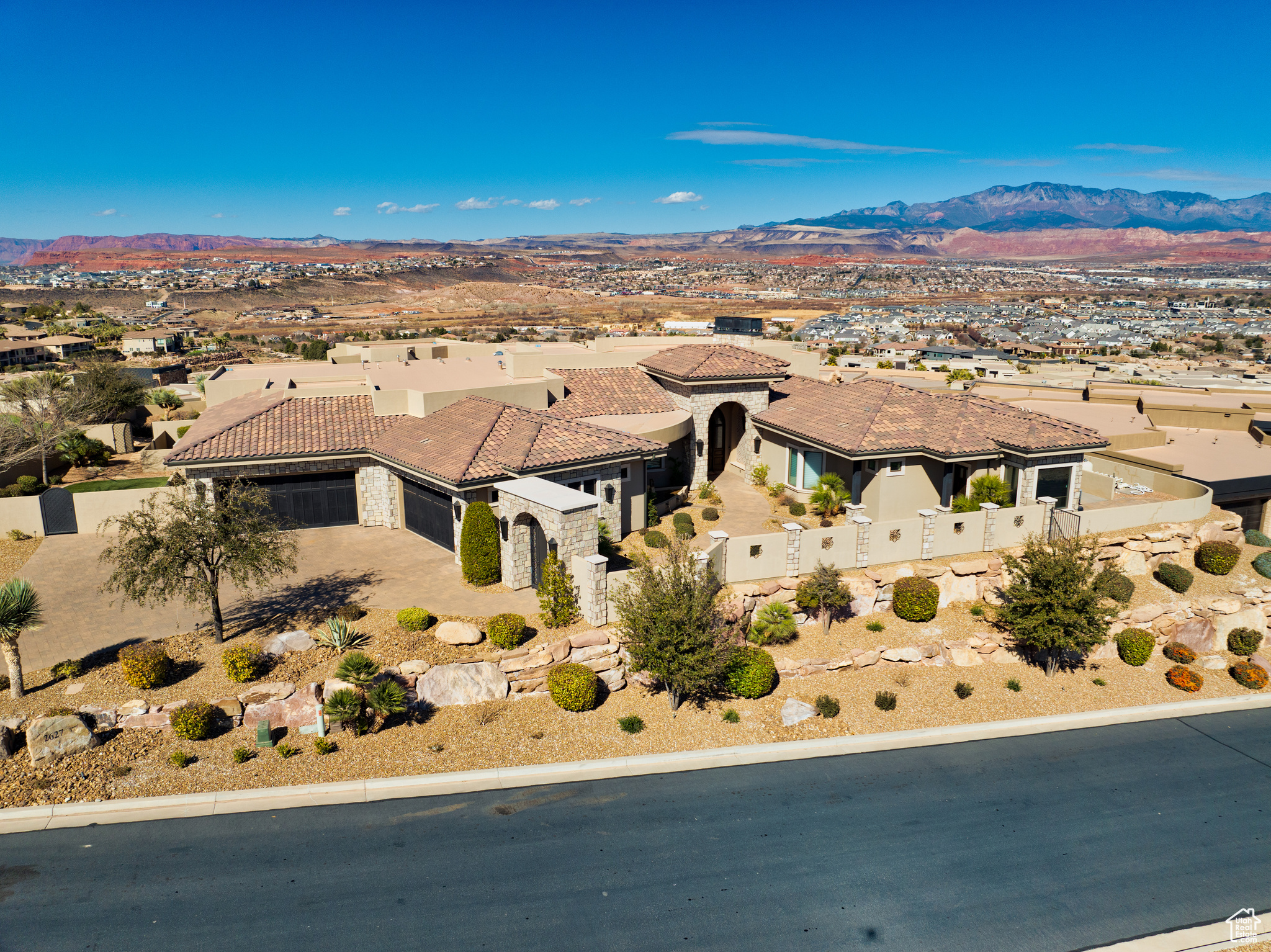 This tunning former Parade of Homes custom residence with incredible views of magnificent southern Utah.  This property has been a second home with considerably less than full time use by its owners.   The floor plan features huge principal rooms.  A split floor plan allows for a fabulous home theater off of the private family and game room, a whimsical hand painted playroom that must been seen to be appreciated and a very private principal bedroom retreat with it's own fireplace/den, his and hers walk in wardrobes, sauna, steam shower and heated marble floors.  Also included are many outdoor features including a fire/pizza oven, large water feature slide, splash pad, dramatic lit water jets that arch into the pool from the travertine patios, full outdoor kitchen, stunning fire features including the island firepit and principal suite fire feature just off the retracting glass walls patio.