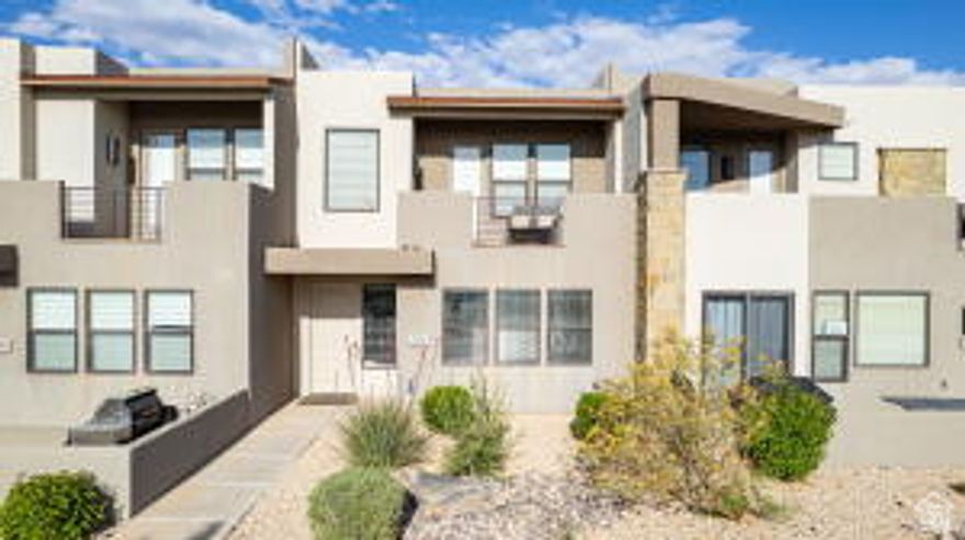 Capitalize on a 100% approved short-term rental asset in the Town Center at Coral Canyon. This turnkey townhome is sold fully furnished with an established track record of past and returning guests. The floor plan features a primary suite on the main level, spacious living areas, and a two-story layout optimized for guest capacity. An upstairs outdoor balcony provides a dedicated sitting area for guests to take in the surrounding landscape. Situated 30 minutes from Zion National Park and 15 minutes from downtown St. George, the location provides immediate access to regional golf, water sports, and hiking. Community amenities include an on-site swimming pool, hot tub, and pickleball courts
