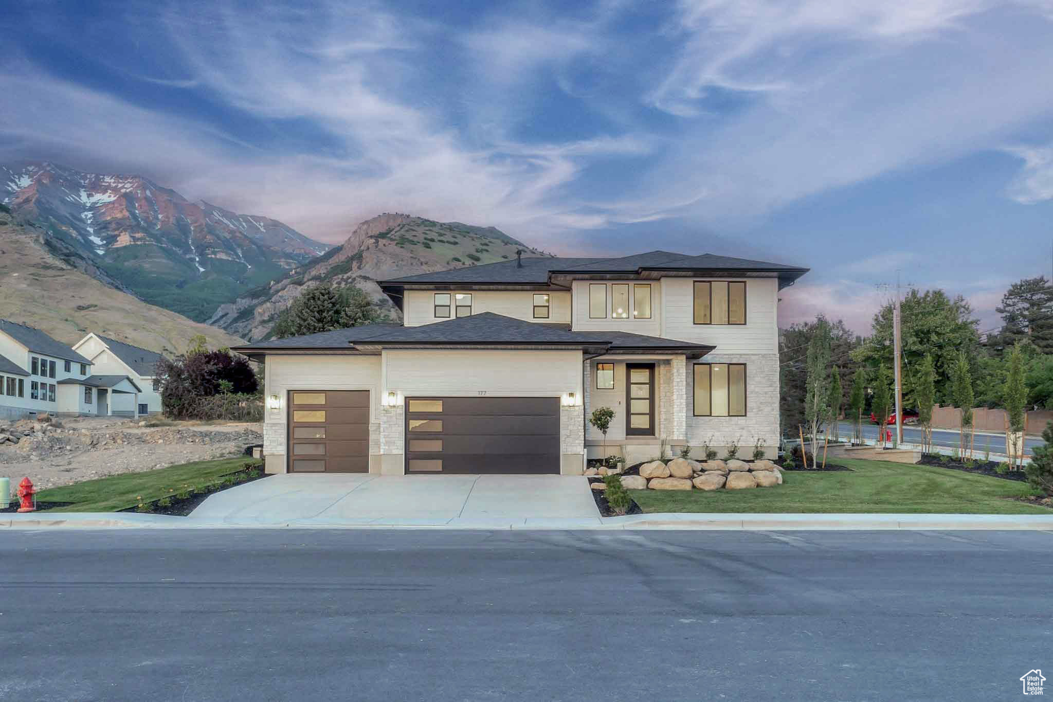 LOT#113. Symphony Homes, brand new Blossom Hill community, located on the east bench! Rhapsody plan. Come see the difference in quality and craftsmanship from this renowned local builder of semi-custom homes! This home is bright and welcoming. The grand two-story entry with beautiful staircase will impress all your guests! This home is filled with designer touches including custom millwork throughout, built-ins in the mud room, nook under the stairs, tray ceiling with crown molding in the luxurious primary suite. You will enjoy the covered patio, the large open great room space, and the finished basement. 3rd stall of the garage has an extra high door and is 34' deep. This home comes with an active radon system and cold storage. Full landscaping is included, as well as a fridge/freezer combo. Fantastic mountain/canyon views!