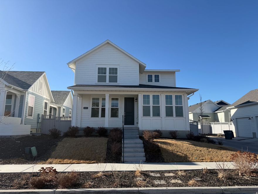 This Spacious 2 Story Home will not disappoint. Home is Move in ready with New Paint and Carpet. Home is 4 years old with all the upgrades you could ask for. Home includes quartz counters, full-sized custom cabinets, updated light fixtures, with spacious bedrooms on each floor. Lots of windows for natural light as well as a great floor plan.  Private Patio off the Dining room with fully fenced back yard.  Basement finished by builder includes: 2 beds, 1 full bath, large gathering space/movies/games etc. This home is also one block from the Watercourse, and a few blocks from Daybreak's restaurant and shopping district. Daybreak Amenities include playgrounds, water/beach, boathouse for kayaks & paddleboards, ducks and a stream. Lots of Retail growth to come. It's also 2 miles from the new SLC baseball BEE's stadium, Megaplex Theater and from Soda Row. Square footage figures are provided as a courtesy estimate only and were obtained from County Records. Buyers are advised to obtain an independent measurement.