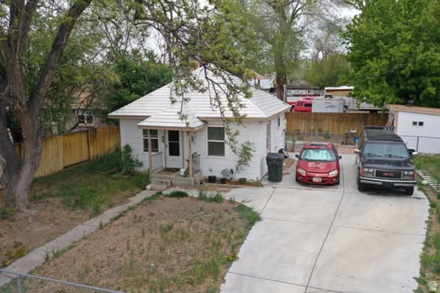 Charming 1-bedroom, 1-bath bungalow in Price offering 484 sq ft of comfortable living space on a 0.11-acre lot. Built in 1927, this home features single-level living, updated flooring, and a functional layout. The property includes a fully fenced yard, RV parking, a storage shed, and mature trees with mountain views. Utilities are connected, and the home is heated by gas forced-air. Conveniently located with easy access to local amenities, this property is ideal for a first-time buyer, downsizer, or investor seeking a solid rental opportunity.  Square footage figures are provided as a courtesy estimate only and were obtained from the Carbon County Records.  Buyer is advised to obtain an independent measurement.