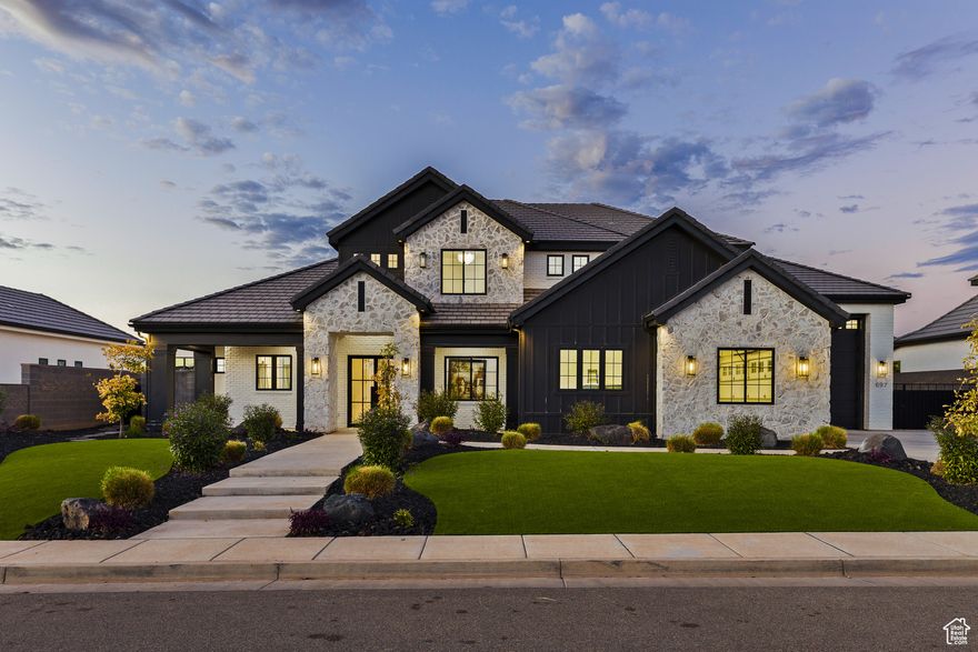 Refined Living with Resort-Style Amenities -- This luxury property in Washington's Queensridge subdivision offers nearly 4,000 sq. ft. of beautifully designed living space on a .37-acre lot. A private swimming pool, infinity-edge hot tub, pickleball court, and gazebo-style cabana create a backyard retreat built for both relaxation and recreation.  The main level features a spacious living room with a gas fireplace and large windows overlooking the manicured, low-maintenance yard. The kitchen centers around an oversized island, complemented by a thoughtfully designed pantry and direct connection to the dining area. A generous laundry room adds everyday function with abundant storage.  The primary suite opens to the covered patio and includes a garden soaking tub, walk-in shower with private exterior access for post-pool convenience, and a large walk-in closet. An office with French doors and a second bedroom with ensuite bath complete the main level.  Upstairs, four additional bedrooms and three bathrooms provide comfortable accommodations for family or guests, with a layout that balances space and privacy.  Parking and storage are well planned with a two-car garage plus an RV garage, offering room for vehicles, gear, and recreation equipment. Within the Crimson Cliffs school boundaries and close to parks and trails, this home blends refined design with resort-style amenities.