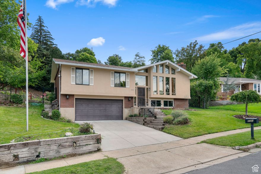 This one owner home is located in one of Bountiful's most desirable east bench neighborhoods & offers the perfect mix of comfort, functionality & amazing outdoor living. You will love the large wooded & very private east facing backyard while you relax, barbecue or entertain on the beautiful  trex deck complete w/surround seating. Inside, this charming 4 bed, 2 bath home still has many original features including lrg front picture windows, vaulted ceilings w/wood beams for accent, 2 fireplaces, 1 gas/1 wood burning, master suite w/master bath, hardwood flooring & built in window seat w/book nook in the front bedroom. Updates include, granite counter tops, newer stucco, wrought iron fencing & of course the amazing deck. This home is also located within the boundaries of Muir Elementary, home to one of the area's most sought-after Chinese Immersion programs, making it an excellent choice for families prioritizing top-tier education. Minutes from the Mueller Park Trailhead, this home is ideal for those who love to hike, bike, or simply enjoy nature.