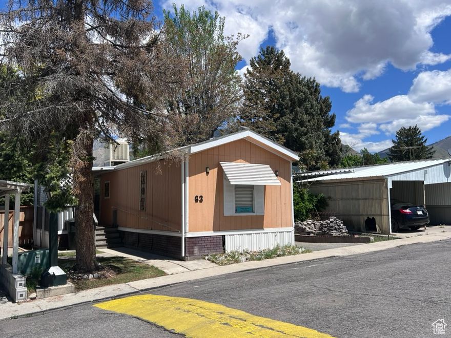 Welcome to this move-in-ready 3-bedroom, 2-bathroom mobile home in South Springville Terrace. Priced at just $125,000, this home offers both value and versatility! Enjoy nearly 1,000 sq ft of single-level living with updated laminate flooring and a cozy open layout.  Covered parking fits two cars tandem-style, and the fully fenced lot offers both a front porch and a private back patio and a cute and well-supported tree house. The home is located in a pet-friendly community with a $650/month HOA that covers the lot space. Great Springville location close to schools, parks, and amenities. Schedule your showing today!