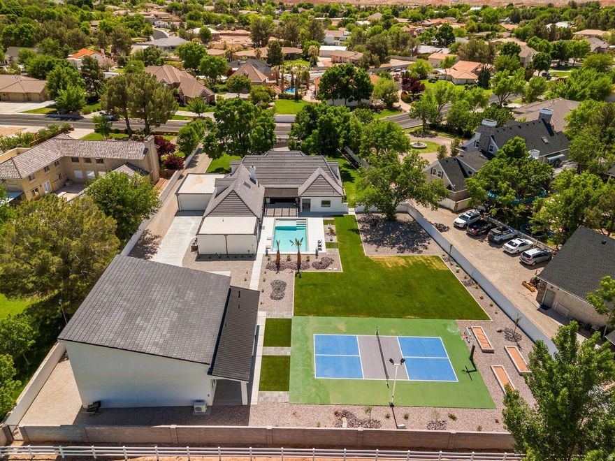 Welcome to this stunning custom Santa Barbara Style Estate with spanish flares nestled on a sprawling 1-acre lot in the Bloomington Ranchos, offering the perfect blend of traditional charm and contemporary luxury.As you approach the property, you'll be captivated by the elegant arched doorways, windows and a vibrant white exterior with black accents and roof tiles that evoke the essence of modern architecture. Step inside to discover an open-concept layout adorned with high ceilings, a bridge walkway with iron railing, natural walnut trim and large windows that flood the space with natural light. The split floor plan design provides 3 separate wings of the estate, so plenty of space for everyone. The gourmet kitchen boasts state-of-the-art appliances, custom walnut cabinetry, and a spacious island perfect for entertaining. The adjoining living area features a cozy fireplace and seamlessly connects to outdoor living spaces with a retractable iron and glass door creating the ideal setting for enjoying warm evenings under the stars. The 2nd level has a private on-suite and double loft area that serves as another gathering space. Retreat to the luxurious master suite, complete with a spa-like ensuite bathroom featuring a soaking tub, walk-in shower, and massive closet with private laundry area. The 2nd Owner Suite comes loaded with its own private entrance, laundry room and possible kitchen if desired to accommodate guests in their own Casita. The additional bedrooms are generously sized, each with unique design elements that reflect the home's character. Outside, the expansive backyard is a private oasis, a sparkling pool, sport court, RV Garage/shop with full bathroom (plumbed for kitchen and guest house), garden area, fruit trees and ample space for outdoor gatherings. The RV Garage matches home in style & color with a concrete driveway. The RV Garage is 2x6 construction and will be fully insulated with climate controls. This modern Spanish Hacienda is not just a home; it's a lifestyle. Experience the perfect blend of elegance and comfort in a serene setting that offers endless possibilities for entertainment and relaxation. Don't miss the opportunity to call this exceptional property your own!