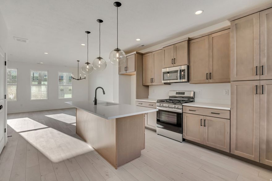 Welcome to our Cabo floor plan! Featuring 4 bedrooms, 3.5 bathrooms. This affordable yet luxurious townhome has an open layout, with plenty of light and a variety of options for personalization. The first-floor open flex space can be used as a home office or additional living room. The second-floor kitchen, featuring an oversized island and a pantry. Right off the kitchen is your outdoor deck. Large windows in the living room and owner's suite let in lots of mood-boosting, natural light. When it's time to relax for the night, the owner's suite is calming and peaceful, with a large walk-in closet, walk-in shower, and dual vanities for ultimate luxury. The Cabo is the epitome of carefree, light-filled living. Investors welcome. Great location with brand new city park just steps away! **The home is complete!** Come visit us in our new model at 1483 W Burke Lane (675 North) Farmington, UT, 84025