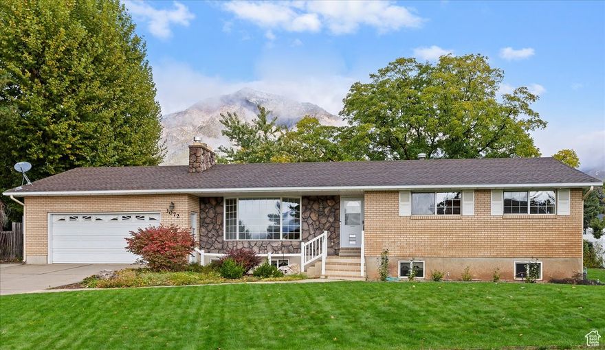 This beautiful North Ogden rambler is move in ready with new carpet, paint, hardware and light fixtures throughout much of the home. With 5 bedrooms and 3 bathrooms, this home is perfectly designed for everyday living and entertaining. Tucked in a quiet cul-de-sac near schools, parks, and shopping. The living room has an oversized bay window that floods the room with natural light and features a stunning fireplace. The kitchen includes stainless steel appliances and plenty of cabinetry. The fully finished basement features a large family room with a second fireplace, perfect for movie nights or gatherings. Enjoy the enclosed sunroom and mountain views year-round. Tons of storage options in the oversized attached garage with built-in storage area. A powered detached 3rd-car garage and shed add extra space for added parking or projects. Experience the best of North Ogden living close to hiking trails and outdoor recreation.