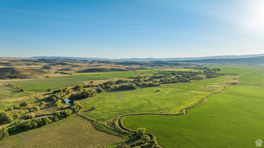 Discover an exceptional opportunity to own 1,265 acres of highly desirable contiguous ranchland in beautiful Cambridge, Idaho. This rare legacy property features 450 irrigated acres with another 186 riverside acres along over a mile of Little Weiser River frontage, and a well-balanced blend of productive hay fields, pasture, a spring, and rolling hills with world-class views.   Perfectly suited for a working cattle operation, agricultural investment, or private hunting + fishing retreat, the ranch includes two modest homes, five large hay barns & shops, granaries, corrals, and a historic homesite. The land offers highly fertile soil with excellent senior (1887) priority water rights, flood irrigation, and 3 pivots. Enjoy incredible fishing and hunt an abundance of deer, elk, duck, and quail.   Whether you're expanding an operation, creating a family legacy, or seeking a premier lifestyle property with income potential, this ranch offers an unmatched combination of scale, water, recreation, and Western charm.
