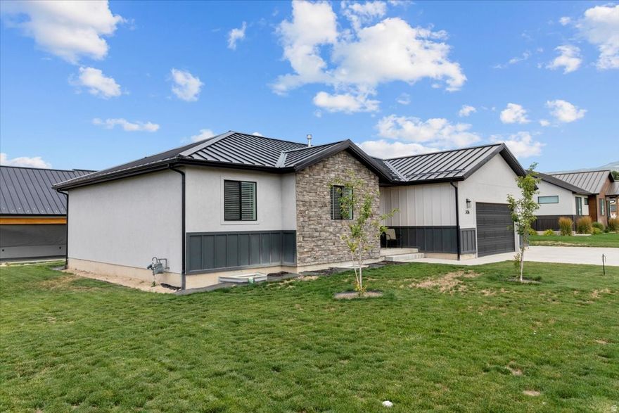 INCREDIBLE home! This deal can't be beat in the entire area! Motivated sellers! Nearly 3,300 sq ft at this value-don't miss your chance to own this gem on a quiet street with stunning panoramic mountain views! Built just over three years ago, this better-than-new home features a fully landscaped yard with automatic sprinklers. HUGE side yards- almost a quarter acre, and plenty of parking for cars and toys. Enjoy bright, open living spaces with high-end upgrades, including a durable metal roof with snow stoppers. The chef's kitchen includes stainless steel appliances, quartz countertops, a stylish backsplash, and ample storage-all appliances stay! Spacious primary suite with double vanity, walk-in closet, plus two more bedrooms and a full bath. The large unfinished basement offers huge potential-add 23 more bedrooms, another bathroom (pre-plumbed), and a rec room to build even more equity. Extras include Trimlight exterior lighting (programmable for holidays), smart switches, and a smart doorbell. This home is a true treasure-make it yours today!