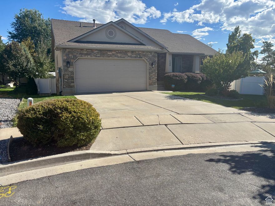 Welcome home to this well-cared for rambler perfectly situated on a quiet cul-de-sac in a desirable location close to schools and shopping. This spacious 5-bedroom, 3-full-bath home offers comfort, style, and functionality for everyday living and entertaining. Step inside to an inviting open kitchen and dining area, ideal for gatherings and family meals. The master suite features a private bath with a double vanity and separate shower, offering a relaxing retreat. Enjoy the convenience of spacious bedrooms and plenty of storage throughout. Recent updates include a new water heater, newer furnace, and A/C, ensuring efficiency and peace of mind. Outside, unwind on the large deck overlooking a beautifully landscaped garden and cozy fire pit, perfect for summer evenings and outdoor entertaining. Enjoy community amenities including a sports court and pickleball court just steps away.