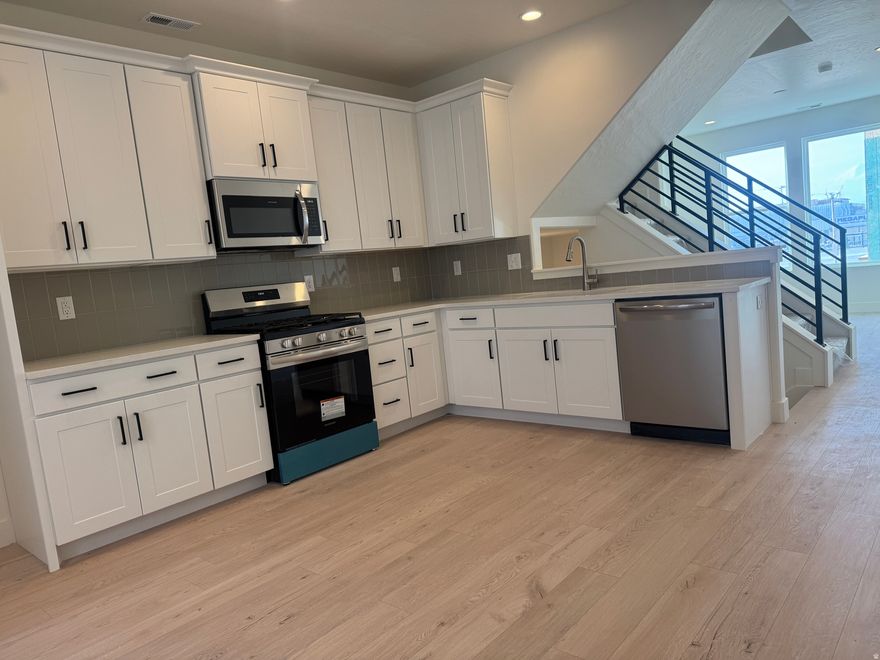 Manhattan Floor Plan in the New Downtown Daybreak Area and just a Short Walk to the Bee's Ballpark! This 2 Bed 1.5 Bath + Flex Room has 9 ft. Ceilings on all Floors and Open Railing for an Elevated and Luxury Feel. Home is at Framing, ETA for Completion is Aug/Sept 2026. **Pics are Example and not of actual home.