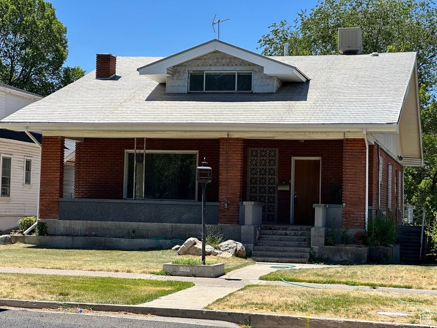 This classic 1916 brick home offers incredible potential with new flooring throughout in a prime location in the heart of Logan. The main home features a spacious gathering area, updated kitchen, two bedrooms, and a bathroom on the main level. Upstairs has three more bedrooms and a bath, while the basement adds two additional bedrooms.  The secondary unit, mother-in-law apartment or ADU occupies part of the basement with its own kitchen, family room, bedroom and entrance. With exterior access to all three levels, there's potential to convert into a tri-plex! Some bedrooms may need window adjustments to meet egress requirements.  A rare opportunity-schedule your showing today!