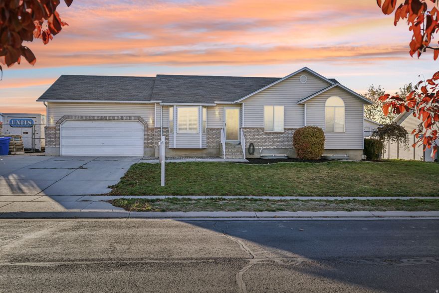 Beautifully updated home in West Jordan with a spacious layout and stunning finishes throughout. The kitchen is a showstopper with rich cherry-stained cabinetry, granite countertops, stainless steel appliances, a large island, granite sink, and travertine flooring. Plantation shutters and updated recessed lighting add style and function to the main living areas. The sellers also just replaced the furnace and AC, so both systems are brand new.  The primary suite includes a walk-in closet and an updated 3/4 ensuite bath. Downstairs you'll find a large family room featuring a fun kids' cave under the stairs, plus a versatile flex room ideal for a home gym, craft room, or office. The main bathroom has also been updated, and the water heater was recently replaced for added peace of mind.  Outside, enjoy a huge lot with no back-fence neighbors for added privacy, along with a two-car garage. This home is move-in ready and offers the perfect blend of comfort, style, and space-don't miss it!
