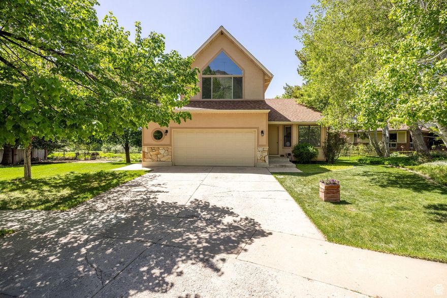 This custom-built Parade of Homes residence boasts a spacious floor plan with vaulted ceilings on the main floor and in the master bedroom, offering a sense of grandeur and openness. The kitchen features a breakfast nook with trees out the window to enjoy nature while eating inside. Abundant storage options include a large walk-in storage room, and a versatile work/hobby room that could easily be converted into a fourth bedroom to suit your needs. Recent updates enhance the home's appeal, with fresh stucco on the exterior, a fully repainted interior, and a new boiler system ensuring modern comfort. You will love the walk out basement with a large patio that's wired for a hot tub. Nestled in a quiet cul-de-sac, this home combines luxury with tranquility, making it a perfect retreat.  Other special items: Automatic sprinklers, LeafFilter rain gutters, triple sinks, walk-in closets, cul-de-sac and mountain views.