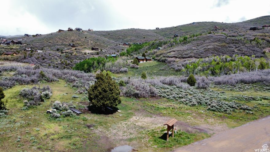 Build your dream home tucked away in the mountains in the clean mountain air! The views are incredible! Convenient access to Heber City, but on a quiet, dead end street. Perc test was done in 2021. Power is looking to be hooked up by a group of neighbors who would split the cost through Heber Light and Power and Septic quotes were obtained by current owner. Water is available through Timberlakes Water Specialists and is run to the property with a spigot on the property. Owner has engineered plans drawn up for a Barndominium. This land could be turned into so many different types of homes!