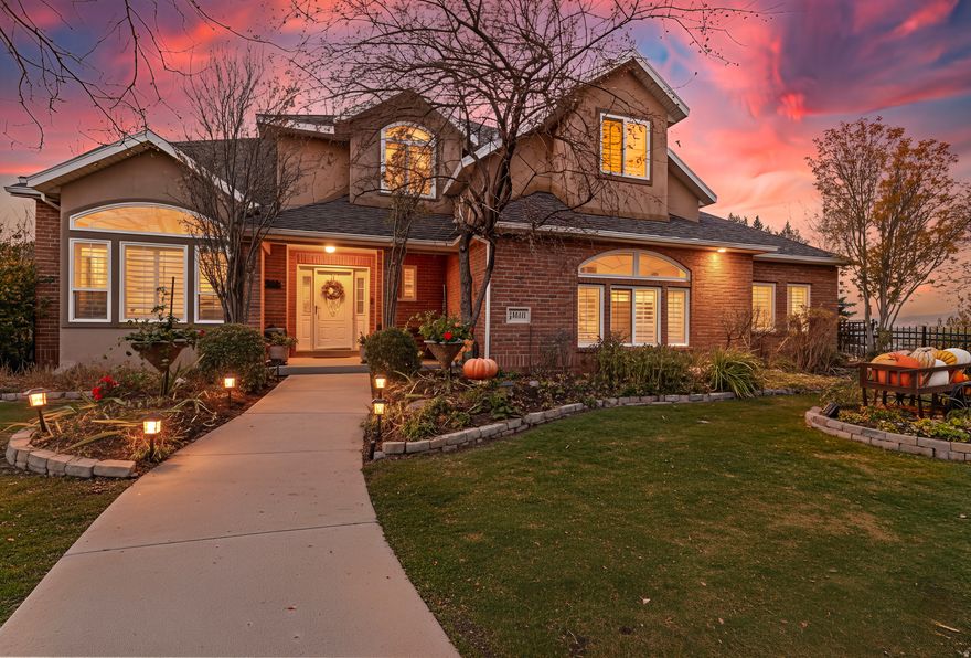 Prepare to be absolutely captivated by the most breathtaking views in all of Draper-views, views, views is truly an understatement at 1671 E Timothy Road, perched on an exclusive single-loaded cul-de-sac overlooking the entire Salt Lake Valley. From the moment you arrive, the lush landscaping, charming iron fencing, and impeccable curb appeal evoke the feeling of an American dream home, while major money-saving upgrades-including a brand-new roof, 41 new windows being installed, two new furnaces, two new A/C units, and a new water heater-provide peace of mind. Step inside to soaring vaulted ceilings, plantation shutters, and sun-filled living spaces that frame Draper's most iconic panoramic views. The gourmet kitchen is a showstopper with granite countertops, a large island, stainless steel appliances, and a new microwave and gas cooktop, seamlessly connecting to a semi-formal dining area and a stunning Trex deck that becomes your year-round front-row seat to July 4th fireworks, evening sunsets, and unforgettable gatherings. The open-concept family room features elegant sightlines, surround sound, and a cozy fireplace. Upstairs, a loft perfect for a home office overlooks the valley, alongside three bedrooms, two full baths, and a convenient laundry space. The expansive primary suite impresses with tray ceilings, plantation shutters, and jaw-dropping views, plus a luxurious ensuite with double sinks, a jetted tub, separate shower, and a massive walk-in closet. The walkout basement offers a mother-in-law apartment with a bright living area, charming kitchenette, gas fireplace, two bedrooms (including one with amazing built-ins for office or craft use), and a full bathroom. Outside, the backyard is a serene retreat featuring the elevated Trex deck, a peaceful patio with a hot tub (with new filters), full fencing, a dog run, two sheds, and an enchanting waterfall feature. Additional highlights include storm doors, RV parking, a side-entry garage, large cold storage, a whole-home humidifier, no backyard neighbors, and the unbeatable perk of backing the South Mountain Golf Course Hole 6 tee box, with instant access to Draper's world-class hiking and biking trails. This extraordinary home combines luxury, comfort, and one-of-a-kind views you won't find anywhere else-truly a once-in-a-lifetime opportunity. ***Seller offering 1/0 rate buydown with preferred lender - 5.301% first-year rate available. Contact agent for details.*** Opportunities like this are rare. Come claim your slice of the skyline. Buyer and Buyer's Agent to verify all information. Square footage figures are provided as a courtesy estimate only. Buyer is advised to obtain independent measurements.