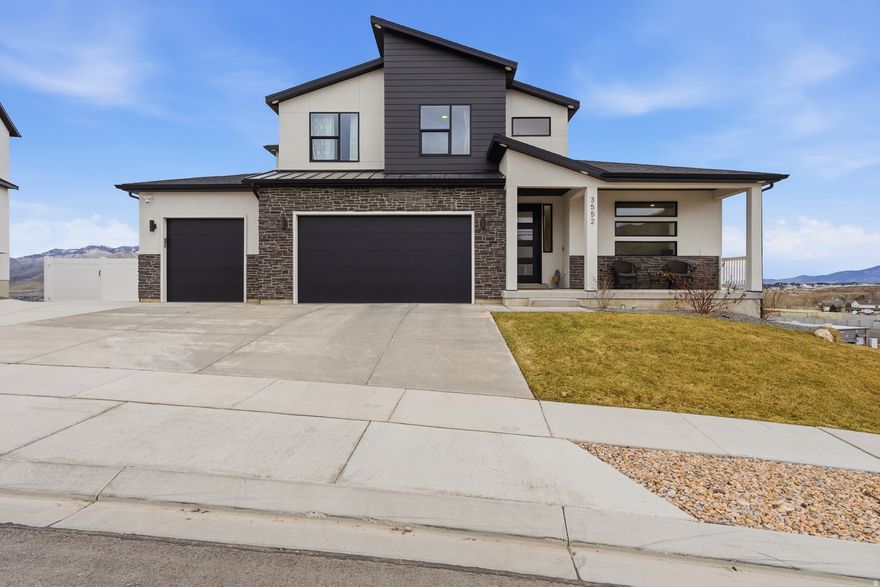 Incredible $25,000 price adjustment to this beautiful home! Welcome to this stunning 2024-built home offering 4,266 fully finished square feet of thoughtfully designed living space. With 8 bedrooms and 3.5 bathrooms, this home delivers the perfect blend of luxury, space, and modern comfort on a quiet cul-de-sac street.  Step inside to soaring living room ceilings and expansive windows that flood the home with natural light while showcasing beautiful mountain views. The open, airy layout is ideal for both everyday living and entertaining, with generous spaces throughout. Upon completion of the home, the kitchen was completely remodeled with custom cabinets and the office was outfitted with custom built cabinets and desktop.  The fully finished daylight basement with walk out adds incredible flexibility - perfect for gatherings, a home gym, theater room, or additional living space. Situated on a spacious 1/3-acre lot, the fully landscaped and fenced tiered yard creates dimension and opportunity for outdoor entertaining, play areas, or future landscaping enhancements.  Complete with a 3-car garage and contemporary finishes throughout, this nearly new home offers space, views, and functionality in one exceptional package. Close to the new Mountain View Highway connection and with grocery and dining incredibly close, this quiet street will get you where you need to be fast.