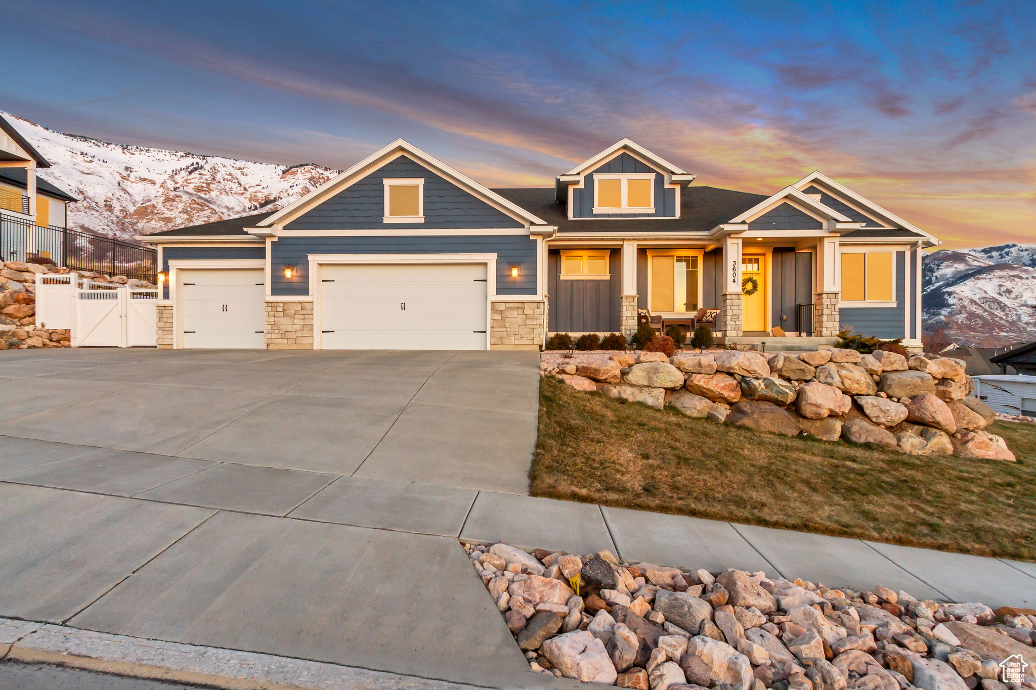 This expansive rambler offers breathtaking mountain views and features, including 4 bedrooms and 2 full bathrooms, plus one mostly finished in the basement. The gourmet kitchen is a chef's dream, complete with double wall ovens, a gas range cooktop, a sleek stainless steel vent hood, granite countertops, and a massive walk-in pantry. The large primary suite boasts panoramic views to the east, a tray ceiling, and plenty of natural light. The en suite bathroom includes double vanities, a separate walk-in shower, jetted tub, and a walk-in closet. The safe in the closet is included with the home. The laundry room is located on the main level, offering the ease of one-level living. The three-car garage includes a deep third bay and 40 feet of RV parking, complete with a 30-amp electrical hook-up-a fantastic bonus for outdoor enthusiasts. The expertly landscaped yard takes full advantage of the walkout basement, leading to a patio with unobstructed views of the mountains and a fully fenced yard. The basement includes one finished bedroom, a nearly completed bathroom with most materials included to finish it, and over 1,700 square feet of space to make your own or have lots of storage. Additionally, the TVs and mounts in the living room and guest bedroom are included in the sale. The best part is that there is an assumable VA loan at an incredibly low 2.75%!  Contact the listing agent for more details.