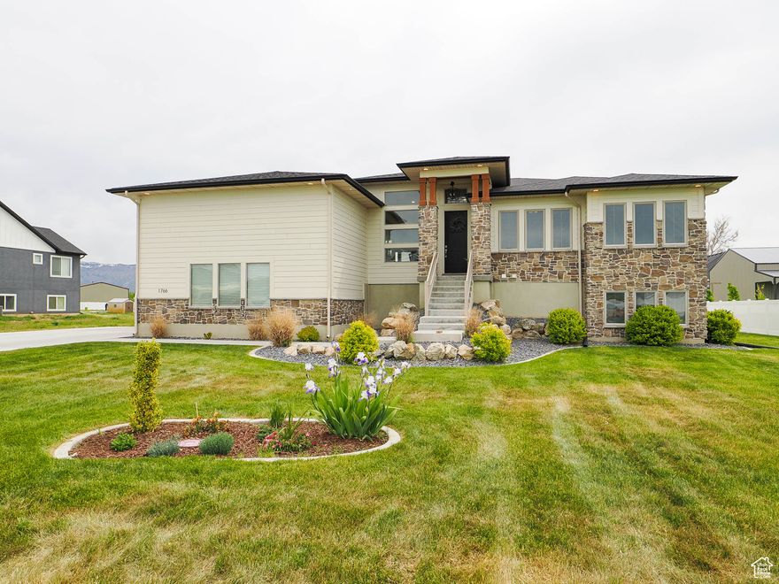 Welcome home! This amazing property features a large .62 acre lot, 4 car garage, and 4500 sq ft that is completely finished with Space in all the right places. The main level has a true gourmet kitchen that showcases, white quartz countertops, 10 foot flat ceilings, high end stainless applianced with double oven and gas cooktop, a large kitchen island, plus a huge butlers pantry. The home has the perfect layout if you like a floor plan that is open and spacious with tons of natural light entering the home through out the day. The master bedrooms is enormous 15x15 with a Huge walk in closet, double sink vanity and large double shower with European style glass. The lower level is a true daylight basement with separate entrance. The flow and design for the basement give the option to use as a great family room/game rooms/media room as if it is a continuation of the main level. But it also gives a great option to have or use the basement as a full ADU apartment including a kitchen and laundry room. This home truly is the perfect space for everyone. Call for a private showing.