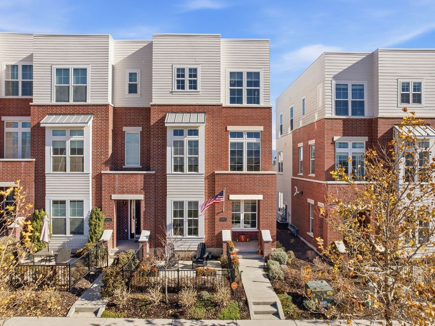 Experience elevated living in this rare end-unit Brownstone Series townhome in the heart of Heights Park Village-one of Daybreak's most walkable and sought-after enclaves. Blending iconic Brownstone architecture with refined modern design, this 3-story residence delivers unforgettable style, premium upgrades, and effortless access to everything that makes Daybreak Utah's #1 master-planned community.  From the moment you arrive, the striking brick faade, fenced front patio, and welcoming covered porch set the tone for a home that is both timeless and sophisticated. Step inside to a bright, open-concept main floor filled with natural light from oversized Amsco windows, where the living room, dining area, and gourmet kitchen flow together as the perfect entertaining space.  The chef's kitchen is a true showcase-featuring dual islands, polished Italian Carrara marble backsplash, 42" MasterCraft cabinets with crown, quartz countertops, soft-close cabinetry, and a full suite of premium Frigidaire Professional and Bosch appliances. Restoration Hardware open-work pendant lights add warmth and elegance.  Upstairs, the luxurious primary suite offers a serene retreat with a spa-inspired bath, soaking tub, separate shower, adult-height double vanity, and boutique Daltile Memoir geometric ceramic tile. With five walk-in closets, storage is unmatched. A private ground-floor guest suite with its own full bath provides exceptional flexibility.  Every detail throughout the home has been elevated:  Brand-new, high-performance Shaw carpet (2025) with spill-proof backing & 25-year transferable warranty  Mannington laminate flooring  Designer Cordless roller shades throughout  Chapman & Myers and Restoration Hardware statement lighting  Quartz countertops in kitchen & baths  Kohler plumbing fixtures  Steel modern stair railings  Dual-zone HVAC  Noritz tankless water heater  Smart-home upgrades abound: Vivint Smart Hub security system with monitoring, glass breaks, door/window sensors, app-controlled automation, Leviton smart switches, Google Nest Hub, and dual Nest thermostats for efficient climate control.  The two-car garage features a professionally installed epoxy floor-clean, durable, and showroom-ready. Outdoor enhancements include Lechuza self-watering planters, Tru Lumens German landscape lighting, and Coolaroo UV solar roller shades for the Trex deck.  Located just steps from Downtown Daybreak, SoDa Row, Oquirrh Lake, walking and biking trails, multiple pools, the full fitness center, University of Utah Health, TRAX stations, and the emerging Downtown district with shops, cafs, entertainment plazas, and the new Salt Lake Bees ballpark - this is one of the most desirable locations in all of Daybreak.  Homes of this caliber rarely come to market. With unmatched upgrades, designer finishes, modern technology, and a walkable lifestyle, this Brownstone offers a level of luxury and convenience that stands above the rest.  A must-see for buyers seeking style, quality, and a truly elevated Daybreak living experience.  Square footage figures are provided as a courtesy estimate only and were obtained from county records. Buyer is advised to obtain an independent measurement.