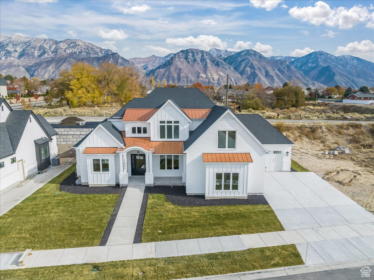 Welcome to the heart of Provo, where thoughtful design and timeless craftsmanship come together in this exceptional residence, designed by award-winning architect Michael Upwall. From the moment you step inside, you'll notice the rich oak flooring and the stunning oak ceiling in the great room-an architectural focal point that brings both warmth and elegance to the space. The luxurious primary suite is a true retreat, featuring vaulted ceilings with exposed oak beams, a spa-inspired bathroom with dual vanities, a dedicated makeup area, a free-standing soaking tub, and a spacious walk-in closet. The gourmet kitchen is equally impressive, with a hidden pantry that helps maintain a sleek, uncluttered look while offering ample storage. Every inch of this home has been carefully curated for comfort, beauty, and function. Located in the sought-after Grandview North neighborhood, the home offers a welcoming atmosphere with tree-lined streets, sidewalks, and a strong sense of community. Residents enjoy proximity to top-rated schools and easy access to both UVU and BYU. Convenient shopping and dining are just minutes away at Provo Towne Centre and The Shops at Riverwoods, where you'll find a wide array of retail, restaurant, and entertainment options. All furnishings are negotiable and may be purchased with the home. Don't miss your opportunity to experience this architectural gem in person-schedule your private tour today!Square footage figures are provided as a courtesy estimate only and were obtained from building plans.  Buyer is advised to obtain an independent measurement.