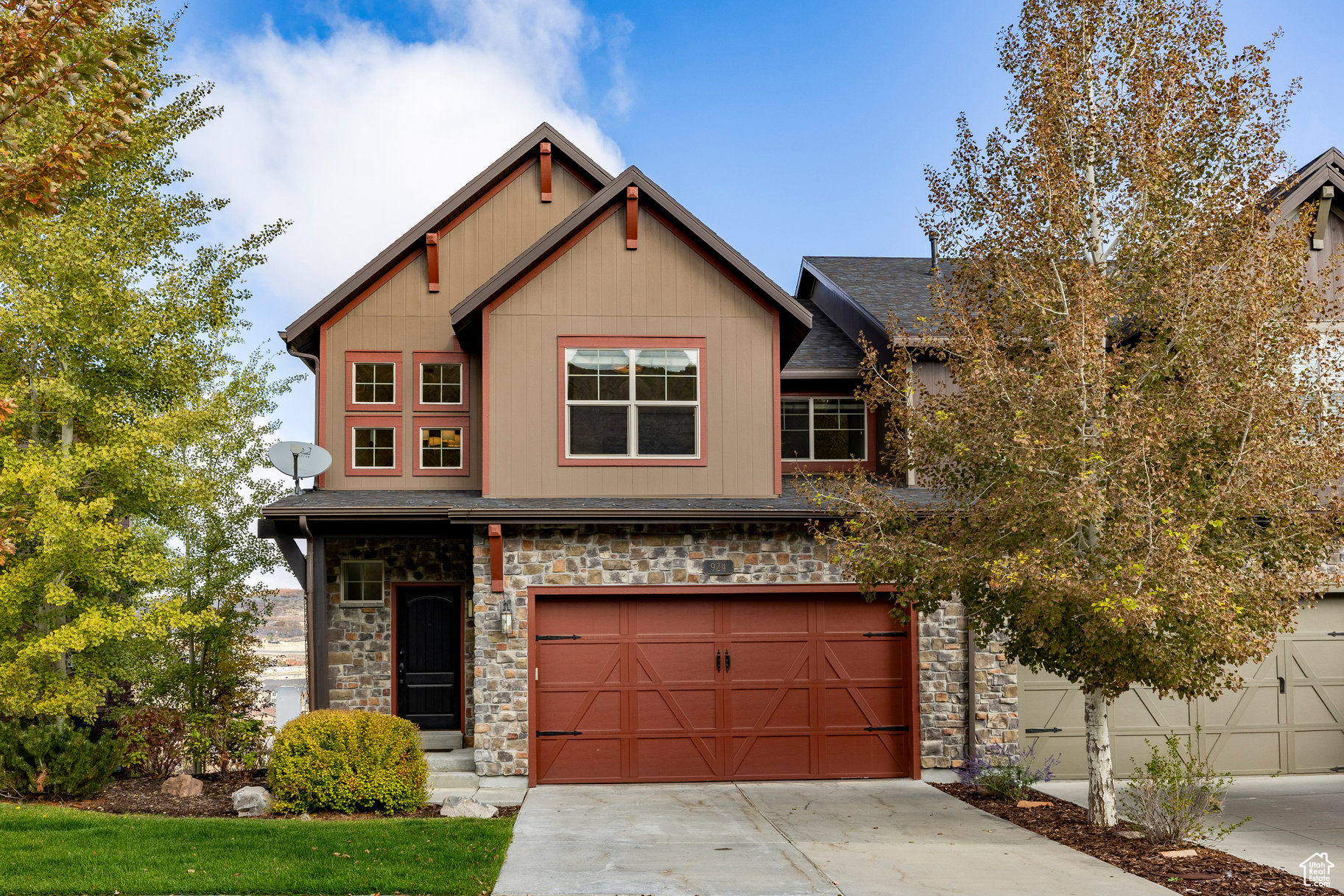 Immaculate 4-bedroom townhome in The Retreat at Jordanelle-an active mountain community just minutes from Park City and world-class ski resorts. This beautifully maintained downhill residence is positioned at the highest point in the subdivision, offering beautiful views over a 5-acre park with well-maintained trails. Extensively updated throughout, the home features an open concept living area filled with natural light, beautifully refreshed kitchen with quartz countertops and backsplash, a new range and microwave, all stainless appliances, and a generous center island with sink. Upgrades include a refreshed fireplace surround, modern lighting throughout, updated living room carpet, main-level hardwood flooring, frameless glass tub and shower enclosures, Nest thermostats, dual EV chargers, a mini safe, water softener, a reverse-osmosis water filtration system, and a hot water heater-all newly installed for modern comfort and style. Upstairs, the primary suite includes an en suite bath, accompanied by two additional bedrooms, a full bathroom, and a convenient laundry room. The lower level adds a spacious family room, guest bedroom, full bath, and access to a large patio complete with a gas BBQ and hot tub-ideal for entertaining or relaxing after a day on the slopes. The south-facing driveway allows for easy snowmelt, and the HOA handles driveway and walkway snow removal for added ease of living. This luxury townhome is perfect for year-round living, a vacation retreat, or an investment property with nightly rental potential. Offered turnkey and includes all TVs. Community amenities include a clubhouse with pool, hot tub, theater room, and fitness center-offering the ideal blend of comfort and mountain living.
