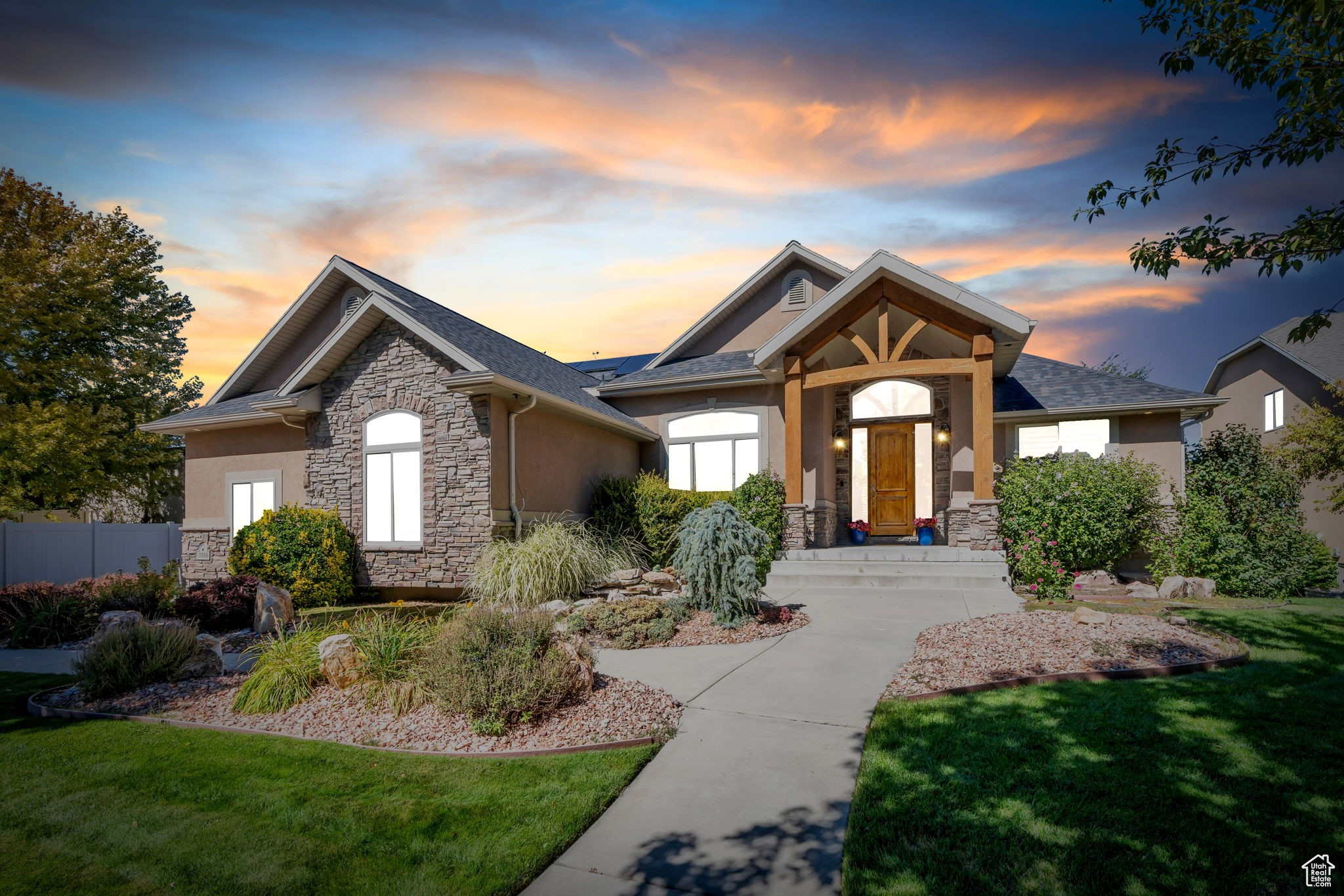 Unparalleled LOCATION, PRICE and AMENITIES - come see this luxurious, updated home located on a .37-acre lot in a quiet South Jordan cul-de-sac! Surrounded by lush, mature landscaping, this home offers an incredible outdoor oasis featuring a sparkling Sports Pool, enormous covered Trex deck, sound system with subwoofer, firepit, and more, ideal for entertaining or relaxing year-round! Grand entrance greets with a knotty alder front door, an exquisite chandelier and adjacent Formal Living Room. The main level showcases authentic hardwood floors coursing throughout and a welcoming, open layout. Pristine Kitchen showcases breakfast-bar seating, granite tops, rich cabinetry and custom tile backsplash! The attached Dining Area offers fantastic space and overlooks the backyard and pool offering seamless indoor/outdoor dining opportunities. The spacious Family Room showcases vaulted ceilings and is ideal for unwinding or entertaining guests! Main Floor also includes a large Primary Suite with a relaxing soaking tub, Euro glass shower, double vanity sink, and a walk-in closet with custom shelving! Downstairs showcases an expansive Family Room with a built-in fireplace and adjacent Kitchen! Additionally, there are two Bedrooms offering options for a home gym, office, or reading nook. Highlights include a $50K solar system, replastered pool in 2025 $30k, new HVAC system, new roof 2021, 3-car garage, and a beautiful front entry pond. Capitalize on this rare South Jordan gem and schedule a showing today!