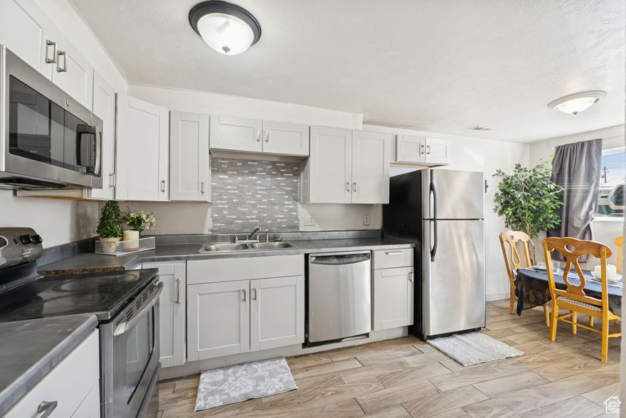 This beautifully remodeled  2-bedroom, 1-bath condo offers a functional layout with approximately 800 square feet of living space. Located near major commuter routes, shopping, and downtown amenities, it's ideal for first-time buyers, investors, or anyone seeking low-maintenance ownership.   At $1,250 a month, the condo has rented  for less than its potential return  The unit features central air, a full kitchen with appliances included. Dedicated parking and a low monthly HOA add to the value. This community has easy access to parks and public transit, this property offers practical comfort in a central location.