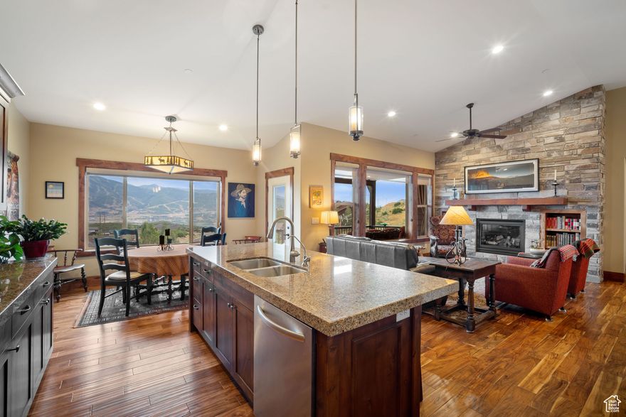 This three-bedroom, two-and-a-half-bath townhome offers impressive views from every room. With a backdrop of Jordanelle Reservoir, Deer Valley Ski Resort, and Mt. Timpanogos, the residence is thoughtfully designed with two separate living areas to accommodate family needs and provide ample space for relaxation. The kitchen offers premium appliances, ample counters, and a large pantry, ideal for cooking and entertaining. The main floor has a vaulted great room with a fireplace, breakfast nook, and deck access, seamlessly connected to the kitchen. The Primary suite is complete with a walk-in closet and ensuite bath, offering privacy and wonderful vistas. Of course, there is also a mud room, a half bath, and a laundry.  High-speed fiber internet supports seamless connectivity. The lower level comprises of two large bedrooms, a full bathroom, a comfortable family room, storage, and access to a large deck with a Hot Tub. Additional amenities include an extra-long driveway and a spacious two-car garage for vehicles and equipment. Mechanical upgrades include a new air conditioning system (installed July 2025), a soft water system (installed October 2024), and a whole-house humidifier. Conveniently located near Park City's premier skiing facilities and recreational opportunities at Jordanelle Reservoir, this property provides an ideal setting for both leisure and outdoor activities.